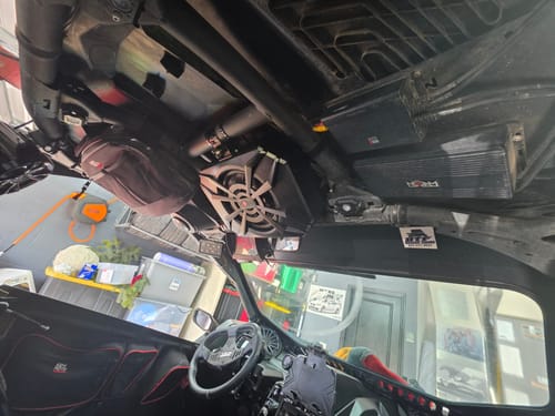 Customer's used NSUB subwoofer installed overhead in the cabin of a utility vehicle.