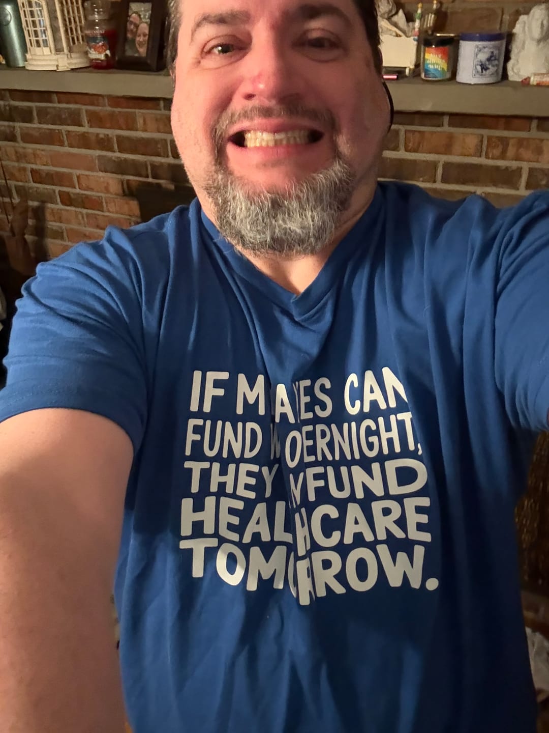 Customer photo review of If My Taxes Can Fund War Overnight, They Can Fund Healthcare Tomorrow Unisex Tee