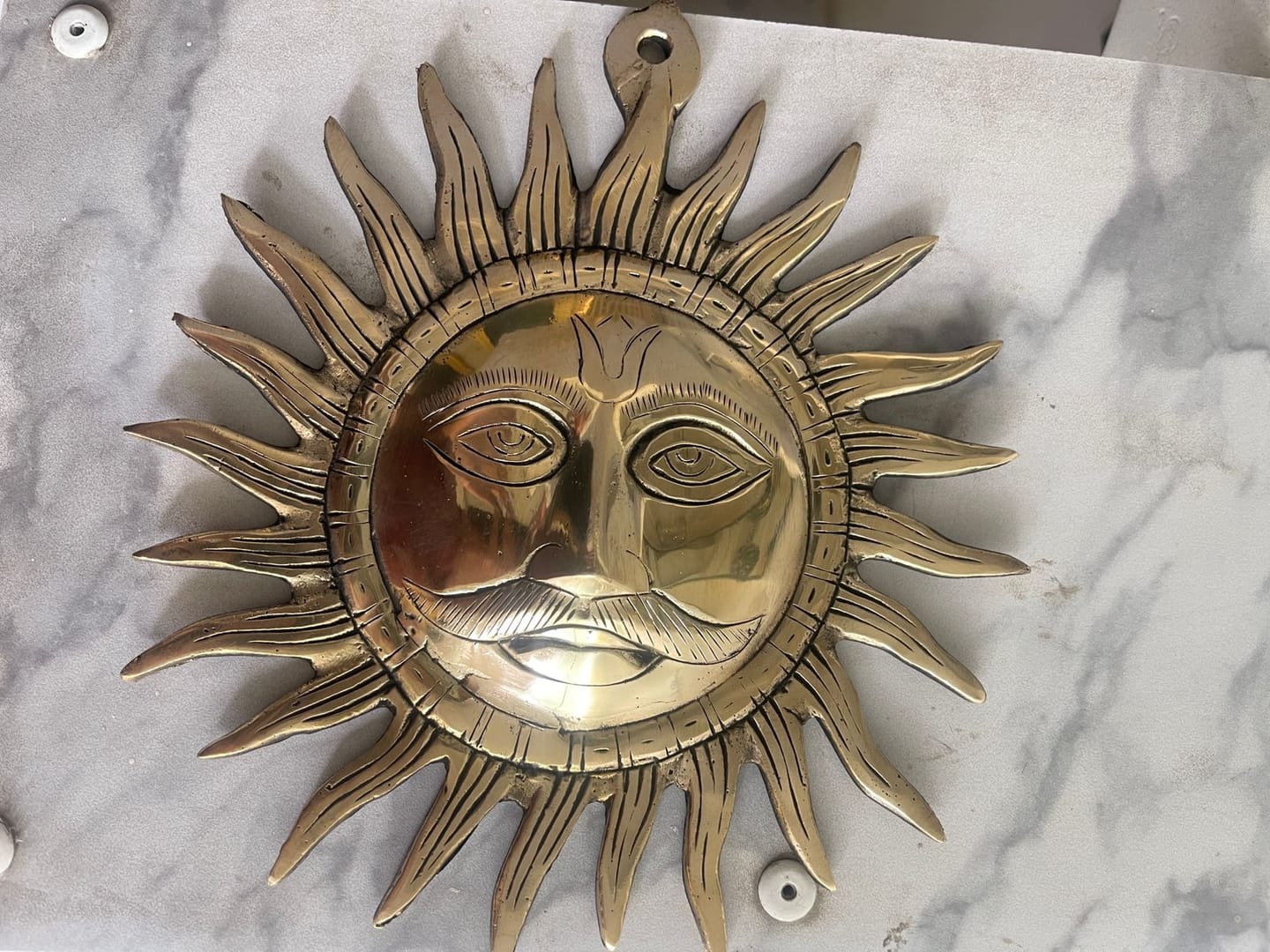 Customer photo review of Brass Surya (Sun) Ji Wall Hanging Idol Vastu Remedy for East Direction Balance, Fame and Positive Energy | 24 X 24 cm | 1 kg