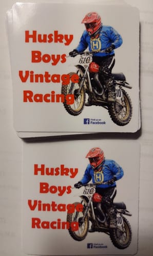 Customer's stack of custom stickers with a vintage motocross racing design.