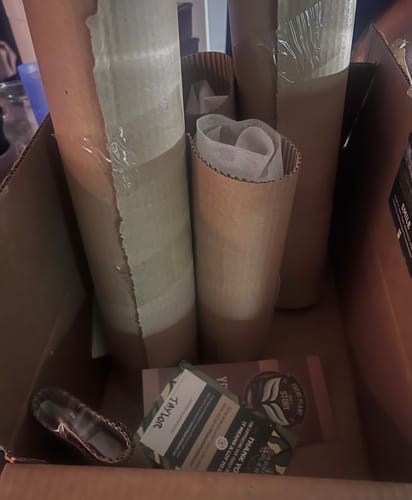 Box containing a customer's plants, securely wrapped in cardboard tubes from the Winter Protection Insurance.
