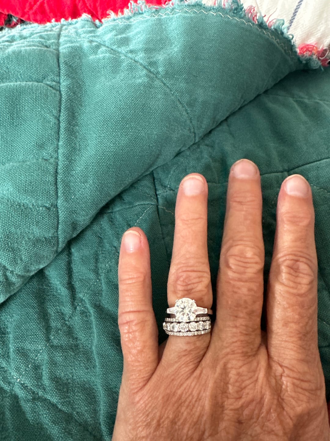 Customer photo review of Three Stone Round Moissanite Tapered Baguette Engagement Ring