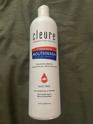 Customer's full bottle of Cleure Cinnamon Mouthwash showing the complete front label.