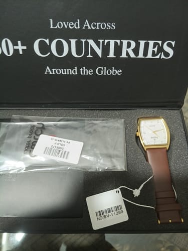 Customer's Sveston Regent watch with a gold case and brown leather strap, shown in its original packaging.