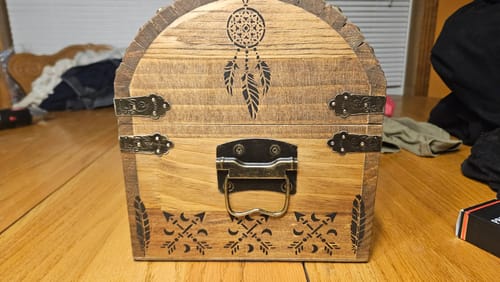 Customer's wooden treasure chest decorated with a dreamcatcher and arrow pattern using Scorch Paint.