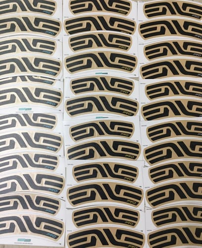 Customer's crisp custom ENVE SES 4.5 Pro Rim Decals in black and tan, shown on multiple sheets before application.