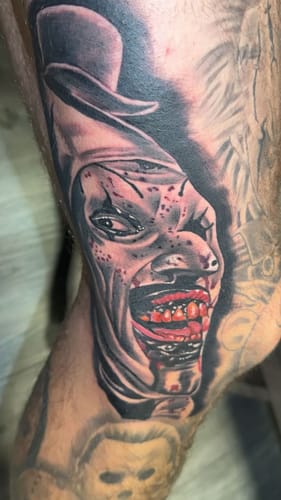 Reviewer's detailed clown tattoo, freshly inked after using the numbing cream for the session.