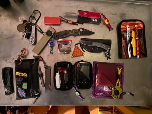 Customer photo review of TRM Tagalong Special Edition DLC Fixed Blade Knife – MagnaCut, Bolts Camo Carbon Fiber Scales, Black Leather Sheath – Made in USA