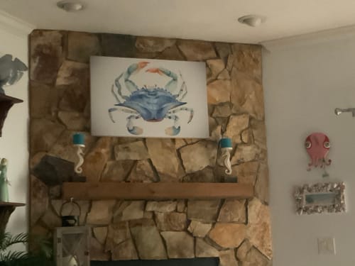 Customer's Crab Watercolor Canvas Wall Art with beautiful colors displayed above a mantel on a stone fireplace.