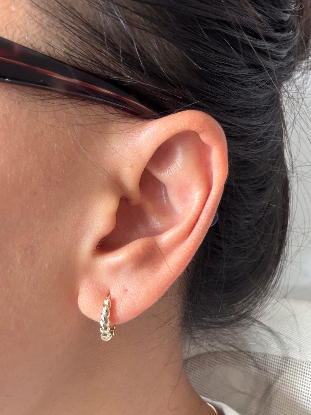 Customer photo review of Mini Croissant Huggie Earrings