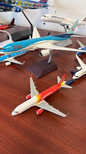 Customer's TUI 787-9 model airplane on its stand, shown with other models from their collection.
