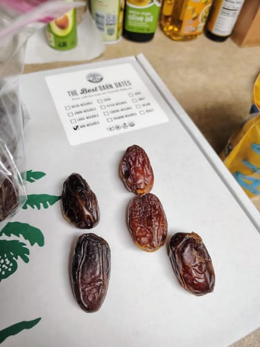 Customer's Mini Medjool Dates displayed on the product box, which has a label confirming the 'mini' size.
