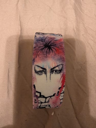 Customer's close-up of the Labyrinth bracelet, showing the watercolor design of Jareth's eyes and the maze.