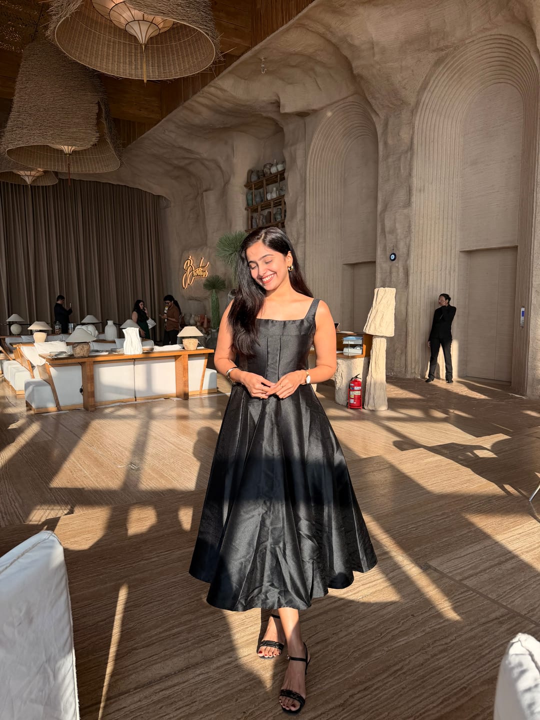 Customer photo review of Rigata Holiday Statement Maxi Dress in Black