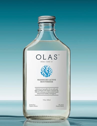 Reviewer's OLAS Marine Bio-Active Mouthrinse in a clear glass bottle with a silver cap.