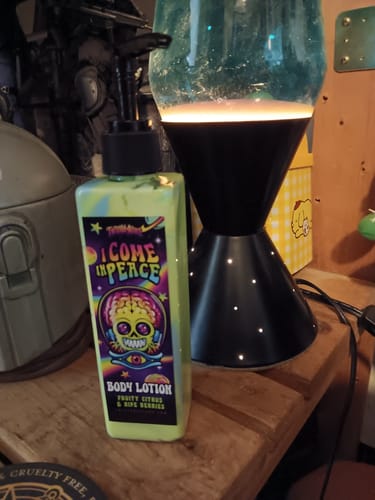 Customer's 'I Come In Peace' body lotion from the Lisas Freaks Sub Box, showing its colorful psychedelic label.