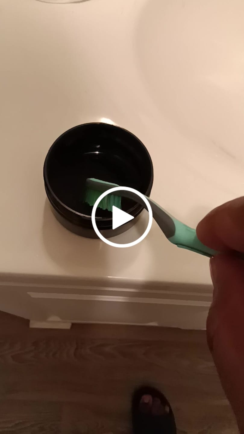 Customer video review of Experience a Brighter Smile with Our Activated Charcoal Teeth Whitening Powder