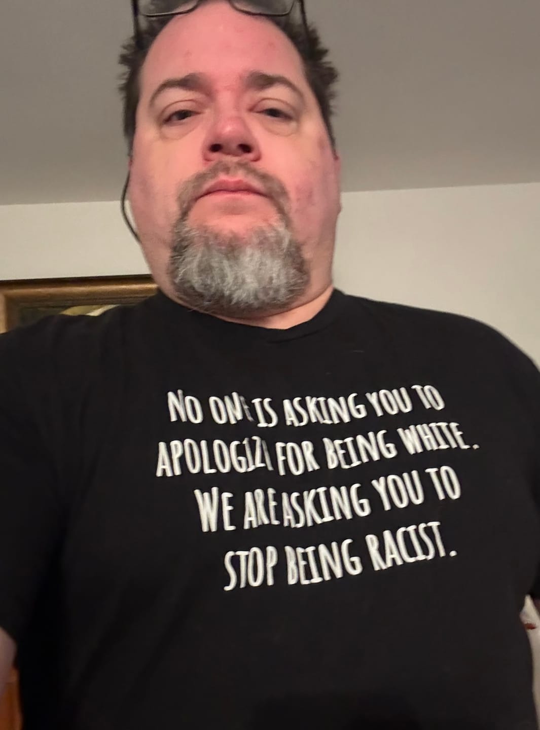 Customer photo review of No one is asking you to apologize for being white. We are asking you to stop being racist Unisex Tee