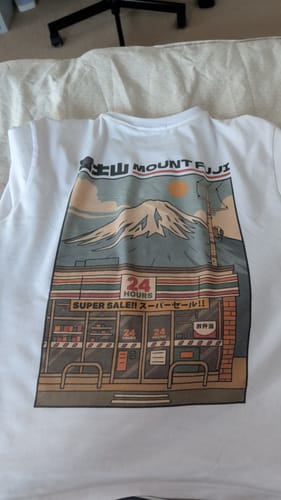 Reviewer's white Fuji Mart T-Shirt laid flat, showing the detailed Japanese-inspired graphic.
