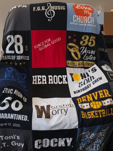 Customer's memorial Premium T Shirt Quilt made from a patchwork of meaningful graphic t-shirts.