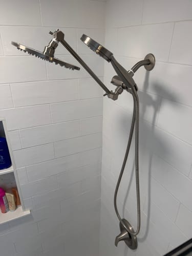 Customer's 3-Spray Dual Shower Head Set in brushed metal, installed in a white tiled shower with both heads extended.