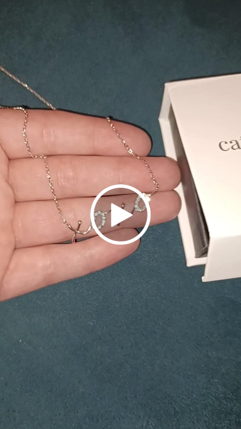 Customer video review of Jocelyn 18k White Gold Plated XOXO Pendant Necklace with Swarovski Crystals