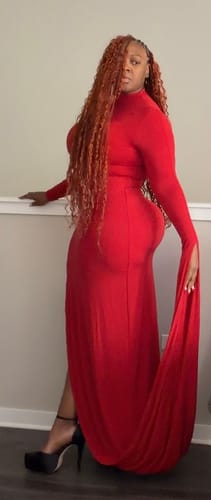 Side view of a reviewer in the red Naked Draped Sleeve Maxi Dress, highlighting the body-hugging fit.