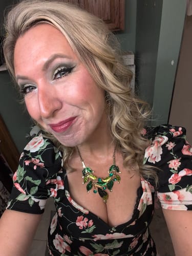 A reviewer smiling while wearing My Amazing Lashes Mascara, showing off long, full lashes.