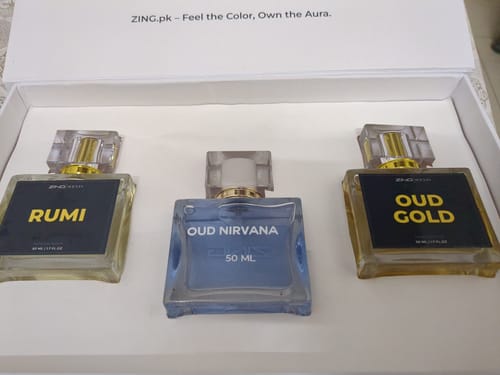 Customer's OUD Supreme BUNDLE showing three assorted perfume bottles in an open white box.