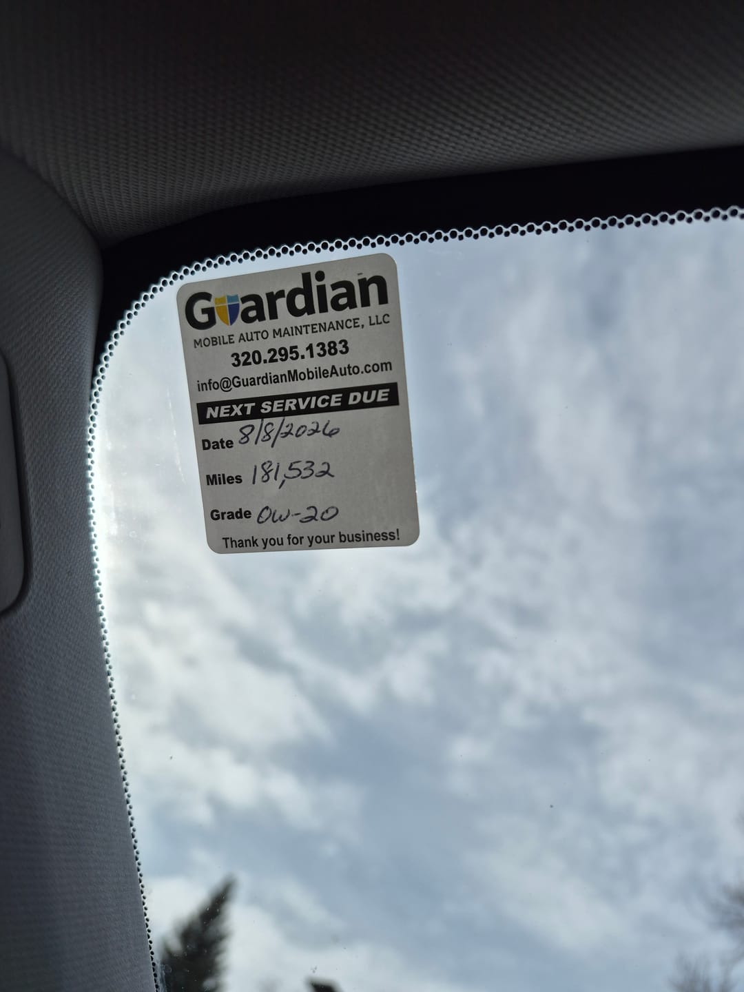 Customer photo review of Custom Oil Change Stickers for Windshield with Logo