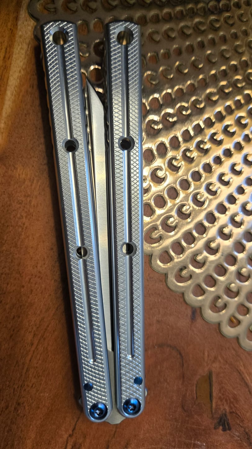 Customer photo review of Blue River Glossy Kraken 7075 Aluminum Handle Titanium Alloy Screws Balisong Stainless Steel Blade Clone Bushing