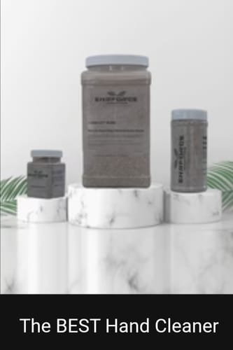 Customer's display of The BEST Hand Cleaner in three different sized jars on white marble pedestals.