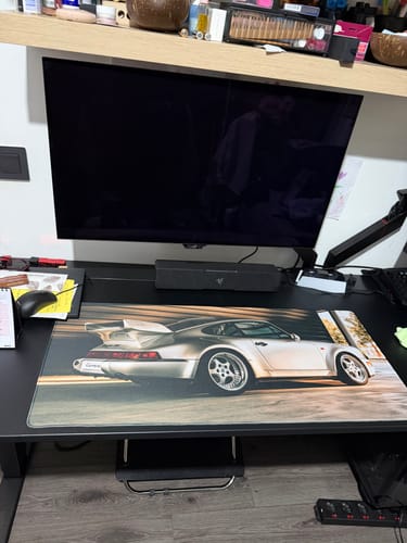 Customer's iD Colossus gaming mousepad with a custom silver car print, shown on a computer desk.