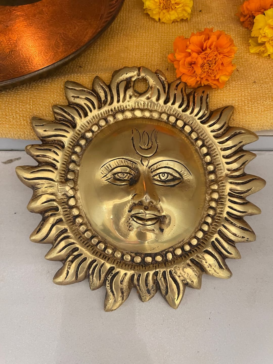 Customer photo review of Brass Vastu Sun Wall Hanging Idol Vastu Remedy for East Direction Balance, Fame and Positive Energy for Home, Office and Entrance Decor | 15 x 15 cm | 940 gm