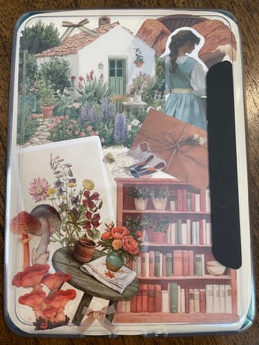 Reviewer's e-reader decorated with a cozy collage of Autumn Cottage Days Stickers, showing a cottage and a bookshelf.