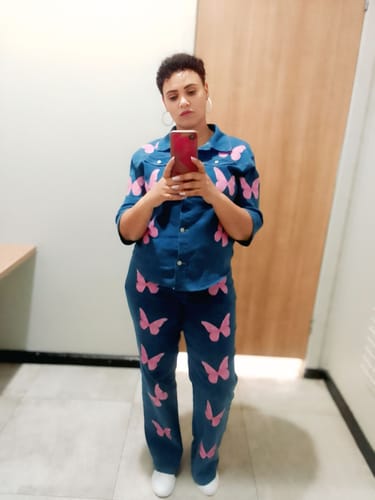 Customer's full-length view of the blue Butterfly Embroidered 2 Piece Jeans set, worn in a mirror selfie.