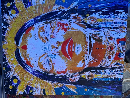 Customer's completed Daughter of Light diamond painting, shown rotated sideways on a surface.