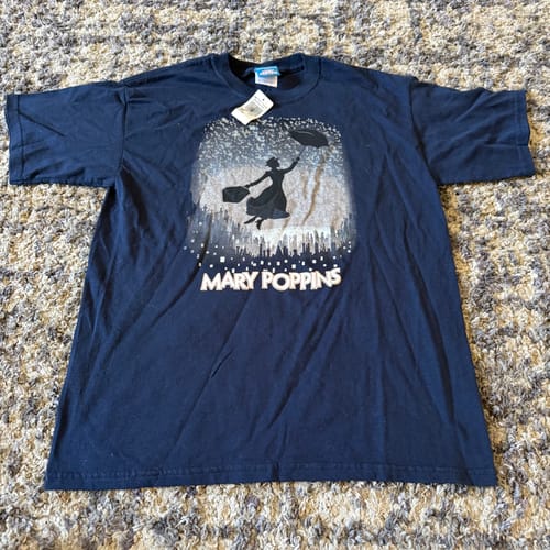 Customer's navy blue B Grade T-Shirt featuring a Mary Poppins graphic, laid flat on a carpet.