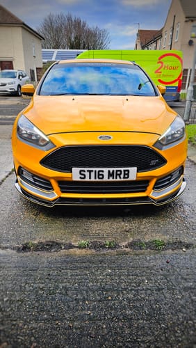 Customer's bright orange car with a high gloss shine after using the Fully Covered Kit.
