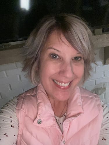 Customer's selfie showing her radiant skin after using the Neptune Grass Fed Tallow & Honey Balm.