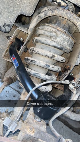 Customer's photo of the newly installed OE Upgrade Upper Control Arm on the driver's side of a vehicle.