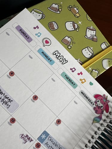Customer's monthly planner showing the colorful Days of the Week stickers used to label Sunday through Wednesday.