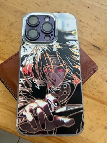 Customer's Itachi Uchiha - Naruto phone case on a phone, showing the detailed and glossy anime artwork.