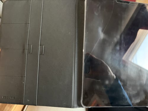 Customer's open black Falcon 9 iPad Folio showing the interior card slots with an iPad inserted.