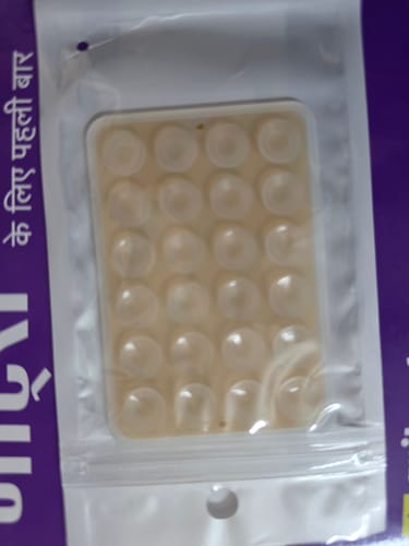 Customer's new StickyPod in its original clear packaging, with the suction cups visible.