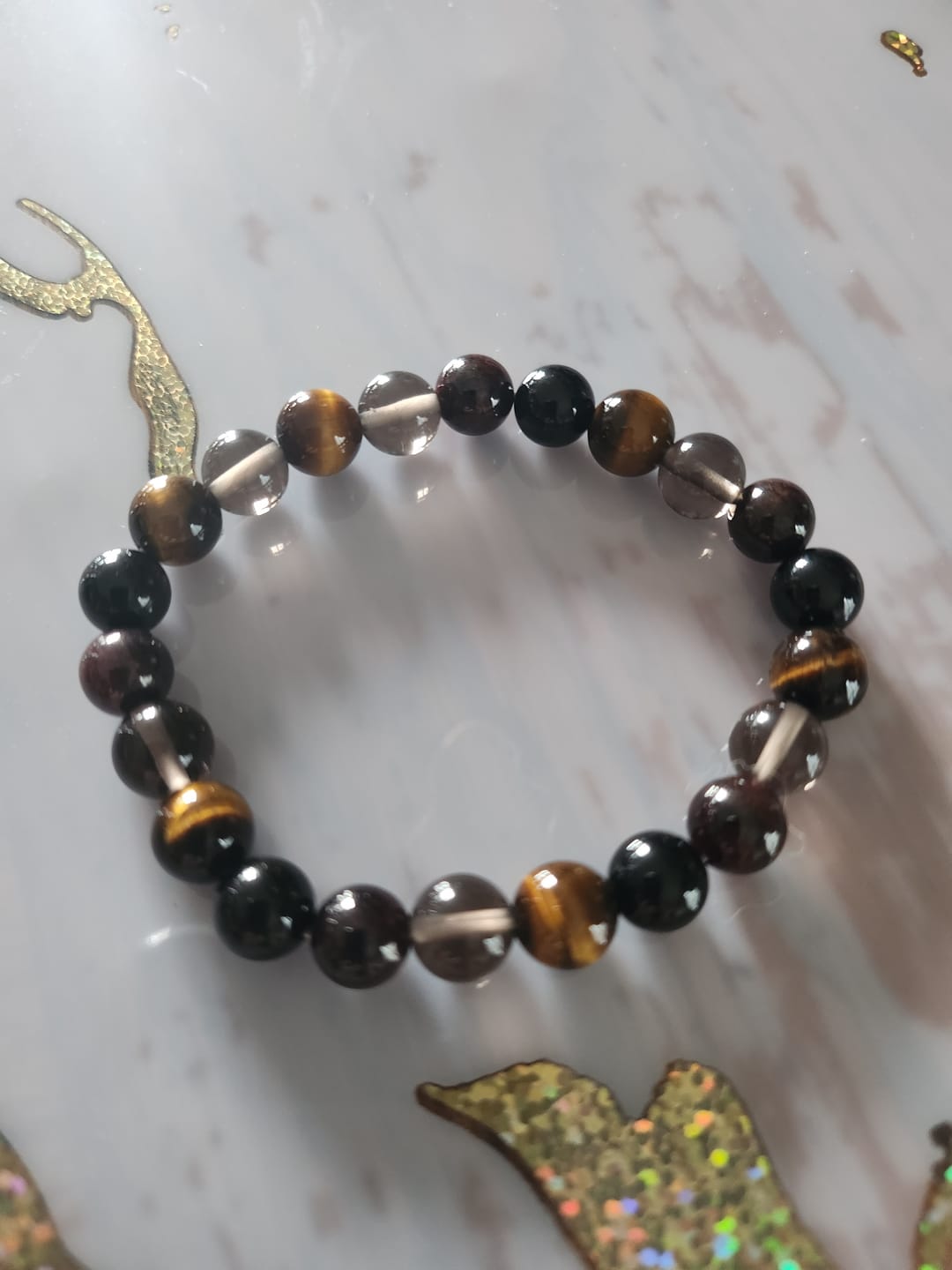 Customer photo review of Bracelet "Réussite & Protection" en Oeil de Tigre, Grenat, Tourmaline & Quartz Fumé