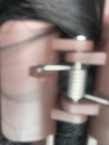 Close-up: A blurry view of the customer's cloud clip holding dark hair in a half-up style.