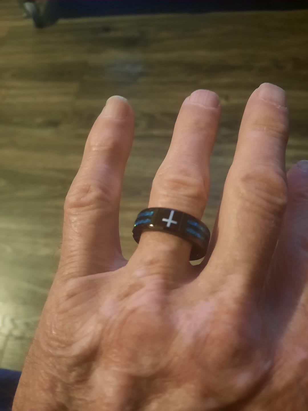 Customer photo review of Christianartworkshop Modern Titanium Steel Cross Ring with Laser Blue Inlay: Serenity in Christ's Blue Light