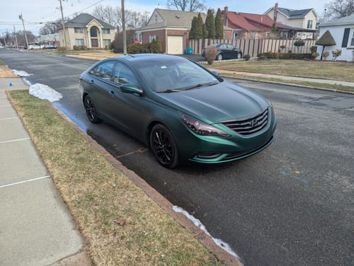 Customer photo review of Satin Chrome Silk Green Vinyl Wrap