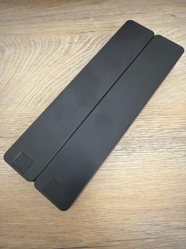 Customer's two black Weekly AM-PM Vitamin Cases shown closed and connected on a wooden surface.